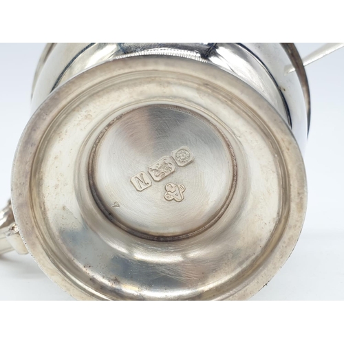 129 - Asprey  London Silver Condiment pot and spoon, weight 197g and 9cm tall approx