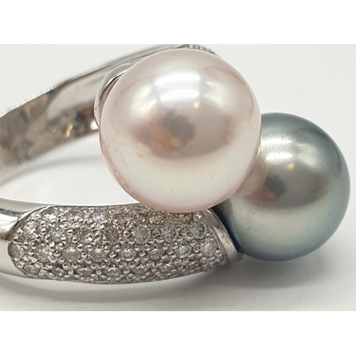 161 - 14ct diamond encrusted ring with 2 different coloured south sea pearls. Weighs 9.2g and is a size O.