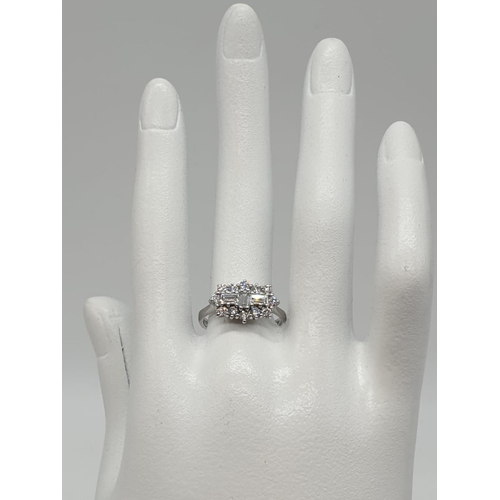 168 - 18ct white gold and diamond ring. Size M and weighs 4.6g.