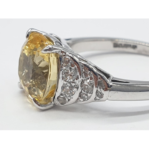 18 - 3.5ct Natural Sri Lankan yellow sapphire shape oval stone in a vintage platinum setting. Weighs 5.3g... 