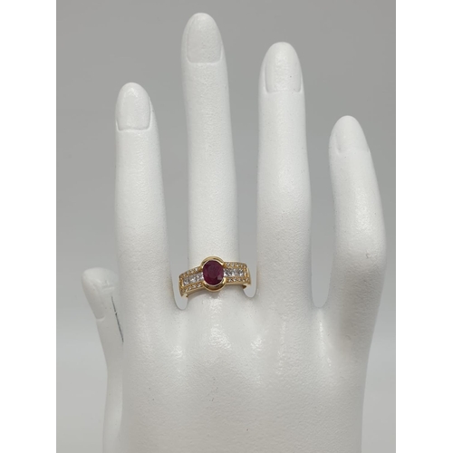 189 - 18ct gold with diamonds and ruby. 6.3g total weight and size K.