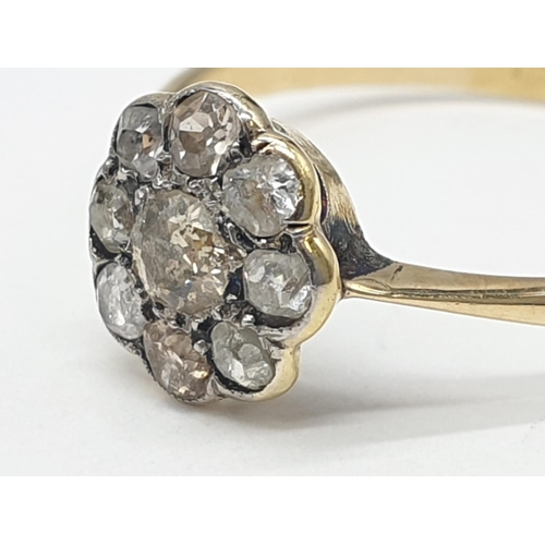 230 - 9ct yellow gold diamond cluster ring in flower design, weight 1.3g and 0.25ct diamond approx, size O