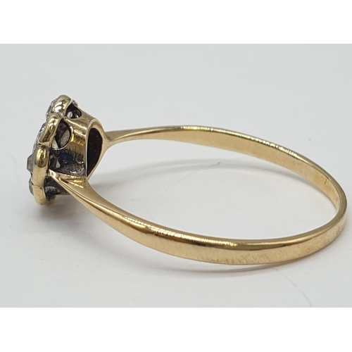 230 - 9ct yellow gold diamond cluster ring in flower design, weight 1.3g and 0.25ct diamond approx, size O