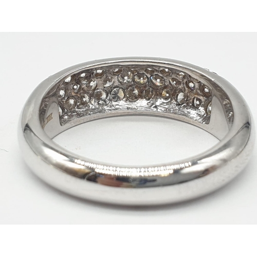 304 - A diamond encrusted 18ct white gold ring. 6.4g and size N.