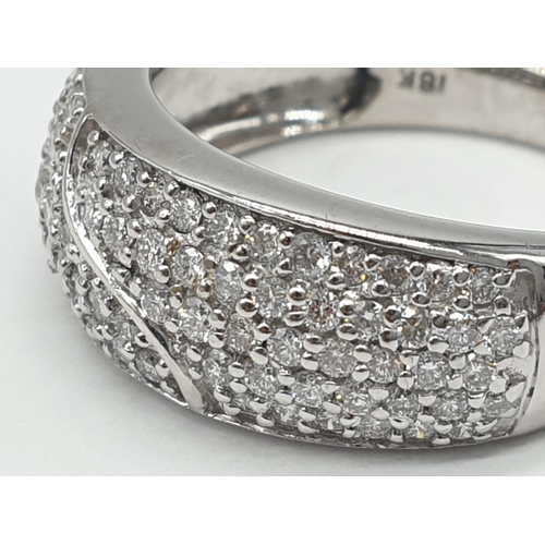 311 - 18ct diamond encrusted stylist ring. Weighs 5.6g and is a size O.