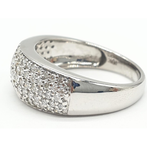 311 - 18ct diamond encrusted stylist ring. Weighs 5.6g and is a size O.