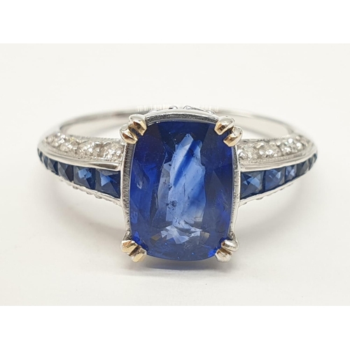 32 - 18ct White gold ring with sapphire and diamonds. Weighs 3.2g and is a size N.