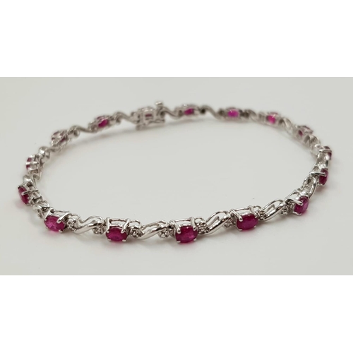 341 - A ruby and diamond ladies bracelet on 9ct white gold. 6.2g total weight and 19cm long.