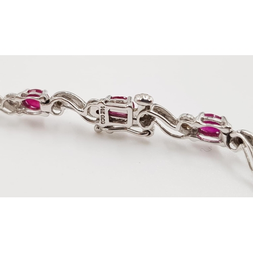 341 - A ruby and diamond ladies bracelet on 9ct white gold. 6.2g total weight and 19cm long.