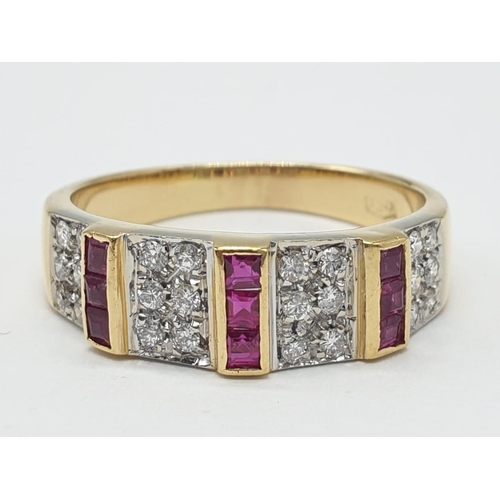 39 - 18ct Gold diamond and ruby ring. Weighs 5.1g and size Q.