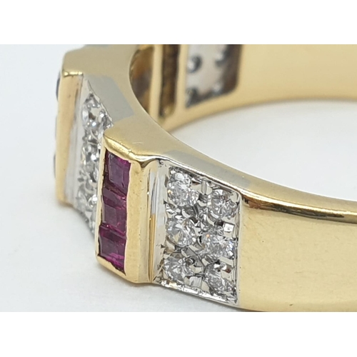 39 - 18ct Gold diamond and ruby ring. Weighs 5.1g and size Q.