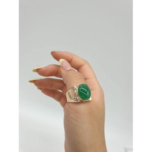 46 - 18ct Gold ring with natural jade stone and diamond shoulders. 16.2g total weight and size R.