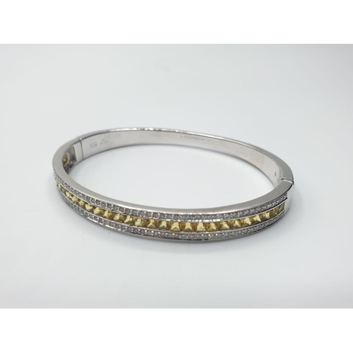 441 - 18ct White Gold Hinged Bangle with Channel Set Diamond ( 0.90ct) and Yellow Sapphire Designed by Ali... 