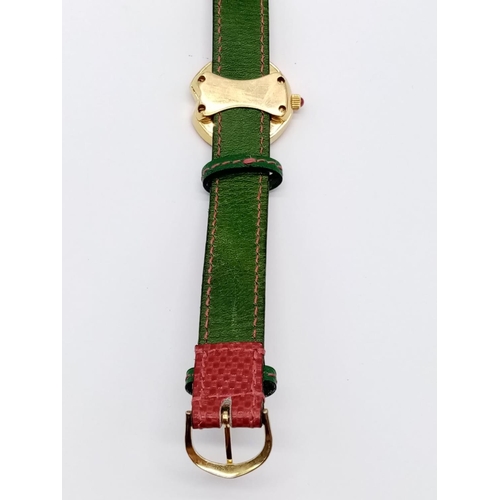 69 - Vintage Bouquet 18ct gold ladies dress watch, round face with emerald, ruby and diamonds surround, 3... 