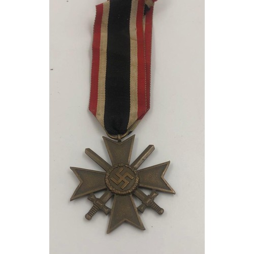 379 - German WW11 merit MEDAL with crossed swords. Dated 1939.