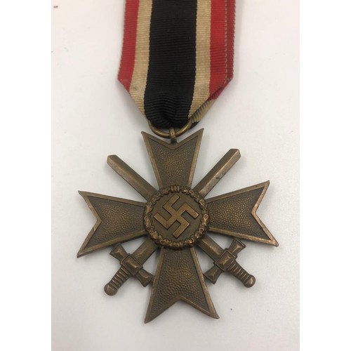 379 - German WW11 merit MEDAL with crossed swords. Dated 1939.