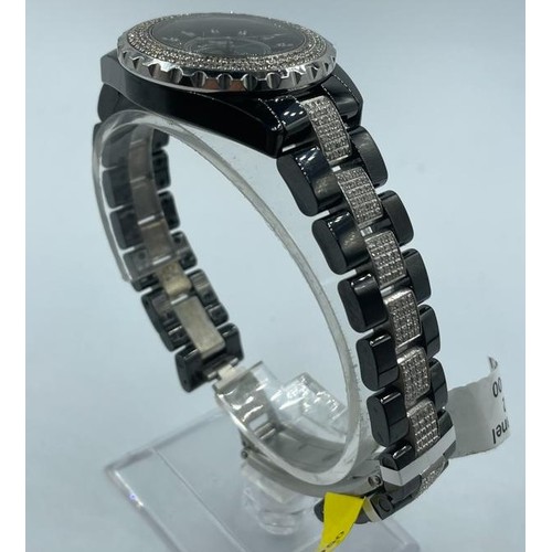 54 - Chanel ceramic quart watch, black face with full diamond bezel and strap