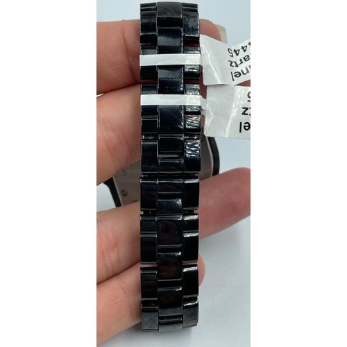 82 - Chanel ceramic quartz watch model J12, black face and full diamonds set dial
