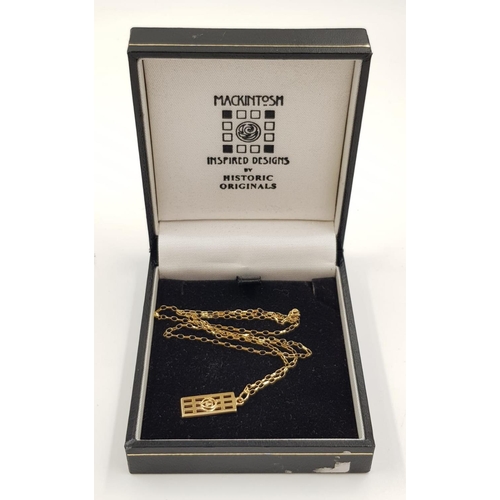 449 - A 9ct gold designer pendant and chain in original box. 1.6g