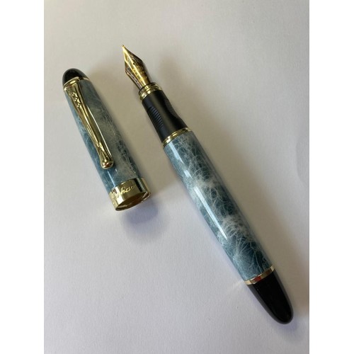 138 - Jinhao fountain pen in blue grey marble design with an 18ct gold plated nib. New and unused.