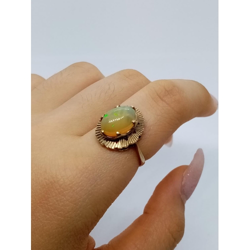 339 - Fine Opal set in 9 cg Gold RING.  3.0g  Size  M.