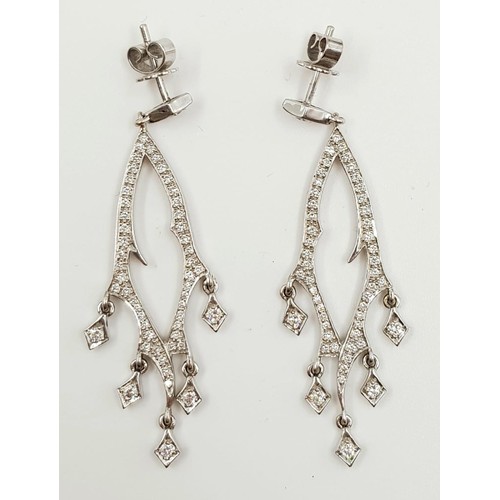 30 - A beautiful pair of 18ct white gold and diamond drop earrings. 5cm drop 9g total weight.