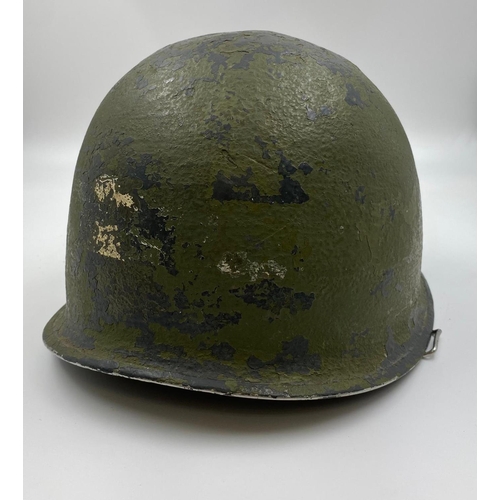 31 - WW2 Front Seam Swivel Bale US M1 Helmet made by Schlueter. The batch number on the rim dates it as 1... 