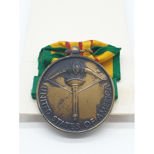 412 - Vietnam War Era US Vietnam Service Medal. In original box with ribbon bar.