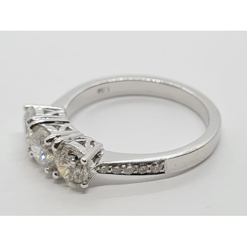 256 - 18ct White Gold with Trilogy set of 1.5ct Diamonds and further encrusted diamonds on the shoulder.  ... 