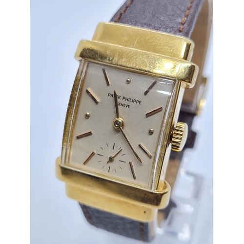 257 - Patek Philippe Geneve WATCH tank style with rectangular face Case: 20x40mm.  Brown Leather Strap.