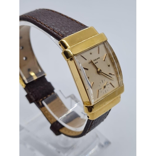 257 - Patek Philippe Geneve WATCH tank style with rectangular face Case: 20x40mm.  Brown Leather Strap.