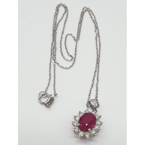 440 - Ruby and Diamond PENDANT on a 18ct Gold CHAIN and setting.  2.7g   38cm