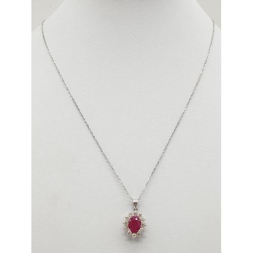 440 - Ruby and Diamond PENDANT on a 18ct Gold CHAIN and setting.  2.7g   38cm