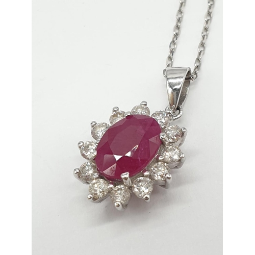 440 - Ruby and Diamond PENDANT on a 18ct Gold CHAIN and setting.  2.7g   38cm