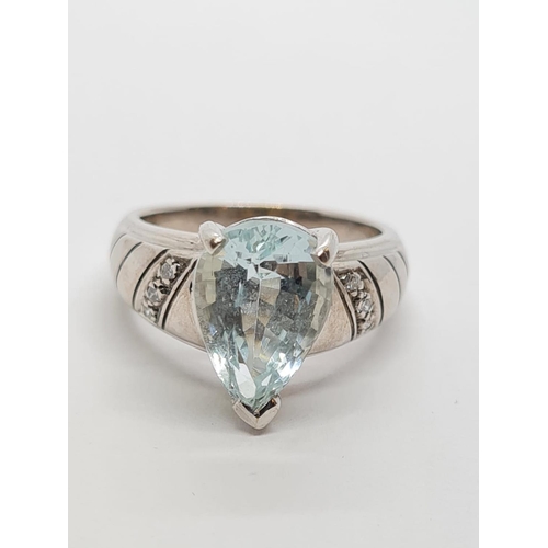 426 - 9ct White Gold Diamond and Aquamarine RING .  5.3g    Size M.