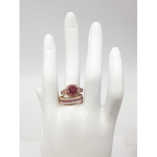 176 - A collection of five double rings (solitaire & eternity) with various gems in velvet red rose shape ... 