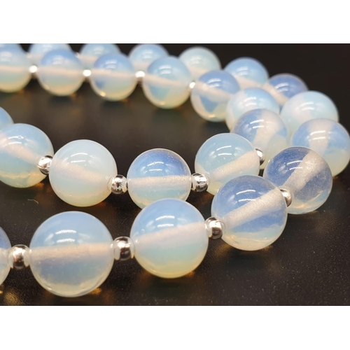 105 - A moonstone necklace, bracelet and earrings set in a presentation box.          
Necklace length: 50... 