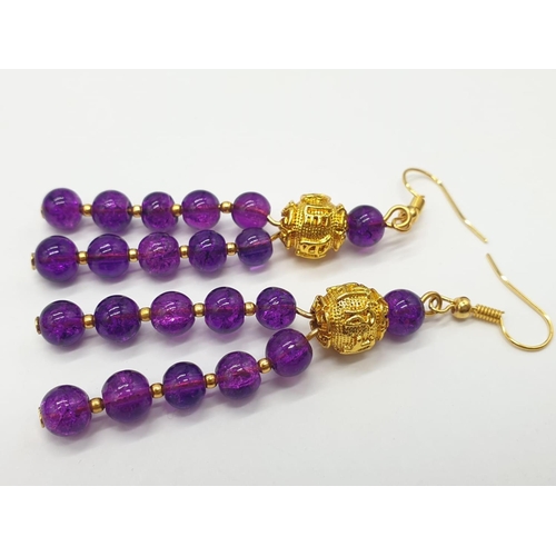 112 - A Mary Quant style necklace and earrings set with synthetic amethyst, following the philosophy of th... 