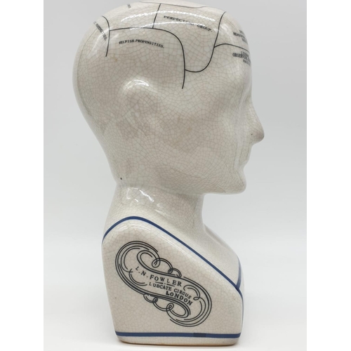 133 - A PHRENOLOGY ceramic bust with detailed mapping of the various areas of the cranial area. By L. N. F... 