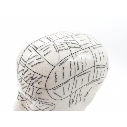 133 - A PHRENOLOGY ceramic bust with detailed mapping of the various areas of the cranial area. By L. N. F... 