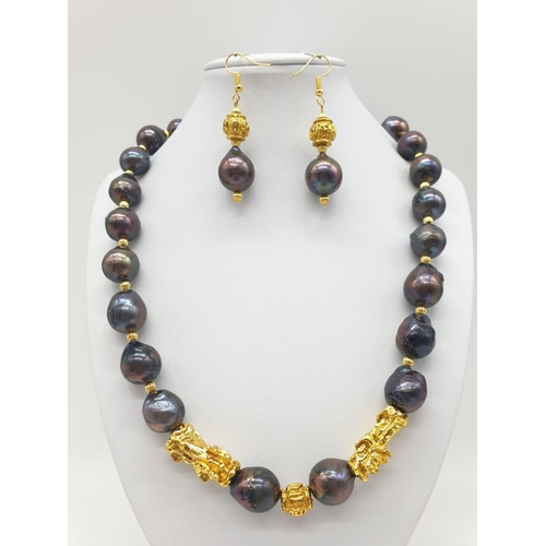 140 - A statement necklace and earrings set with rare, baroque, black pearls and Chinese, gold filled PIXI... 