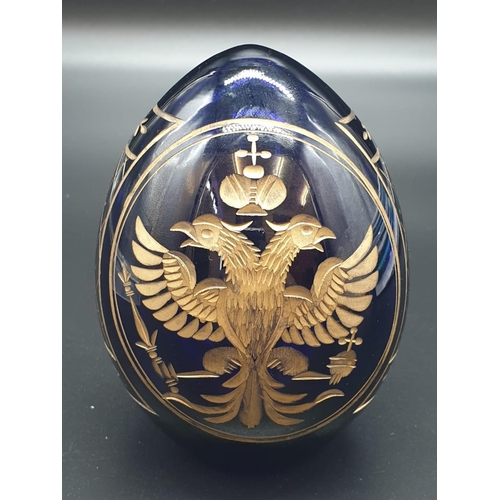 147 - A Russian, Faberge style, cobalt blue, crystal egg, engraved and gilded with the Romanov coat of arm... 