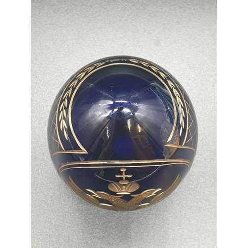 147 - A Russian, Faberge style, cobalt blue, crystal egg, engraved and gilded with the Romanov coat of arm... 