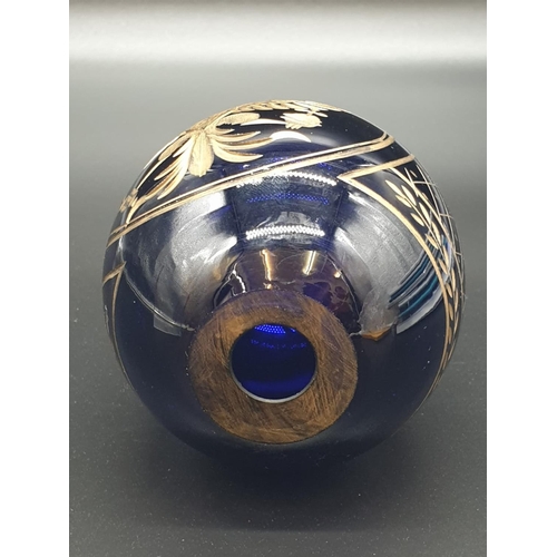 147 - A Russian, Faberge style, cobalt blue, crystal egg, engraved and gilded with the Romanov coat of arm... 