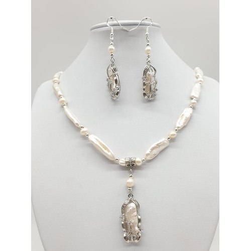 56 - An unusual Biwa pearls and sterling silver necklace and earrings set in a presentation case. Necklac... 