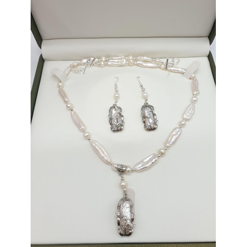 56 - An unusual Biwa pearls and sterling silver necklace and earrings set in a presentation case. Necklac... 