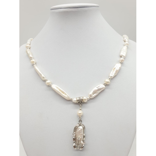 56 - An unusual Biwa pearls and sterling silver necklace and earrings set in a presentation case. Necklac... 