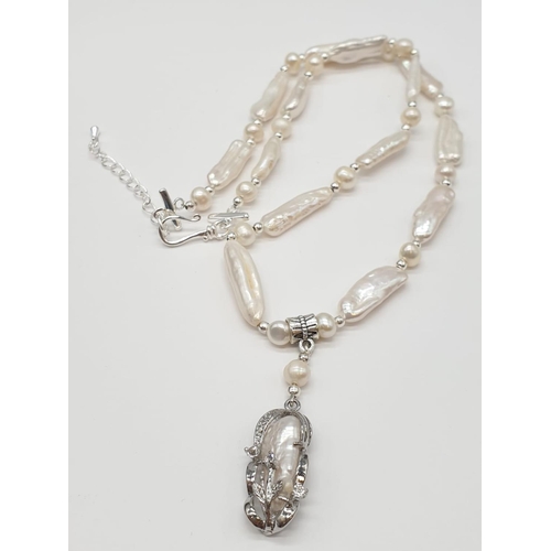 56 - An unusual Biwa pearls and sterling silver necklace and earrings set in a presentation case. Necklac... 