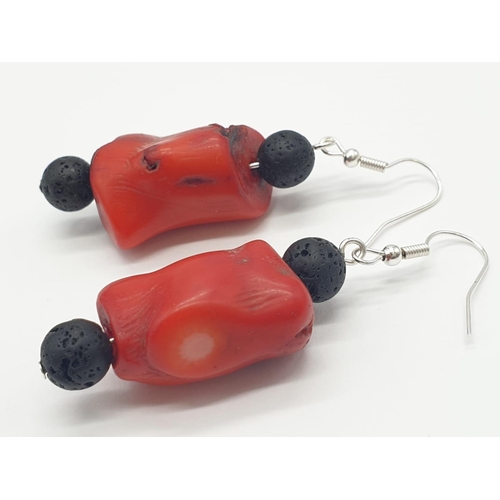 70 - A Hawaiian lava necklace and earrings set, adored with big chunks of Pacific red coral. In a present... 