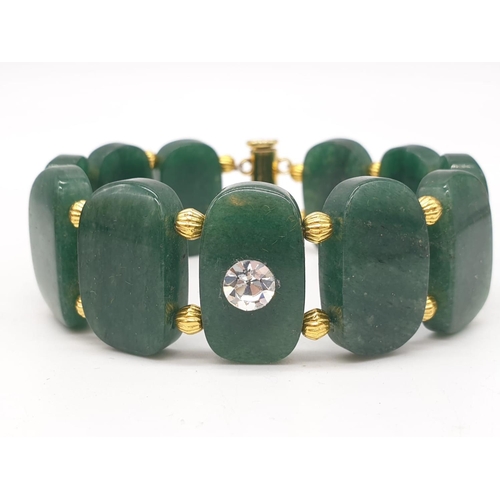 77 - A beautiful articulate jade bracelet in a presentation box. Bracelet length: 20 cm, width: 2 cm.